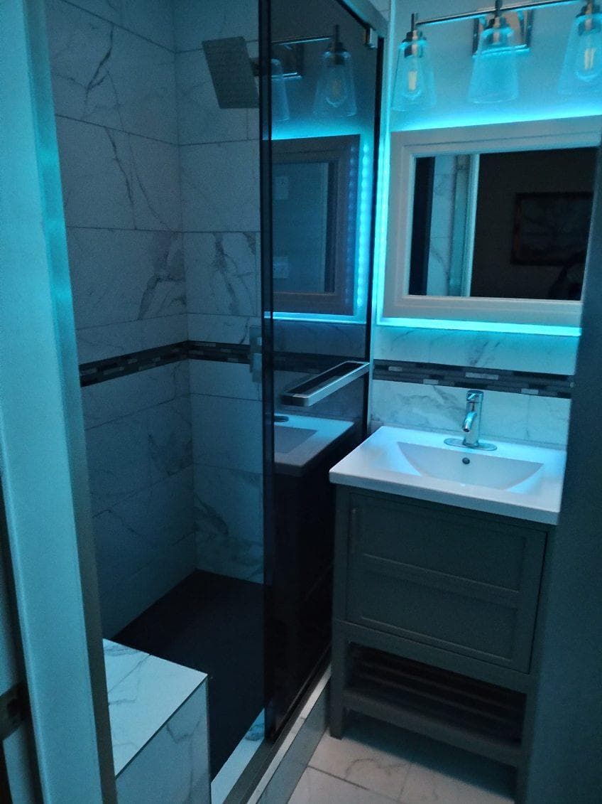 picture of newly remodeled bathroom with custom neon green lighting