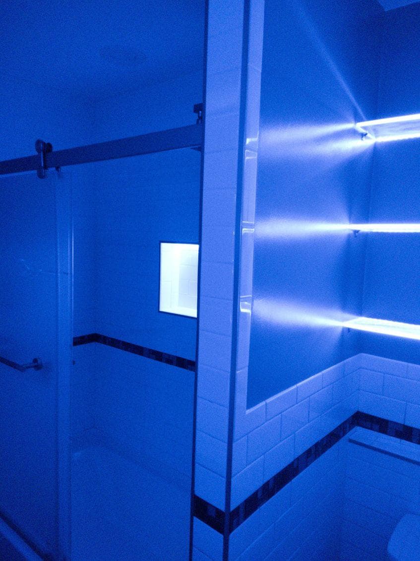 picture of newly remodeled bathroom with custom blue lighting